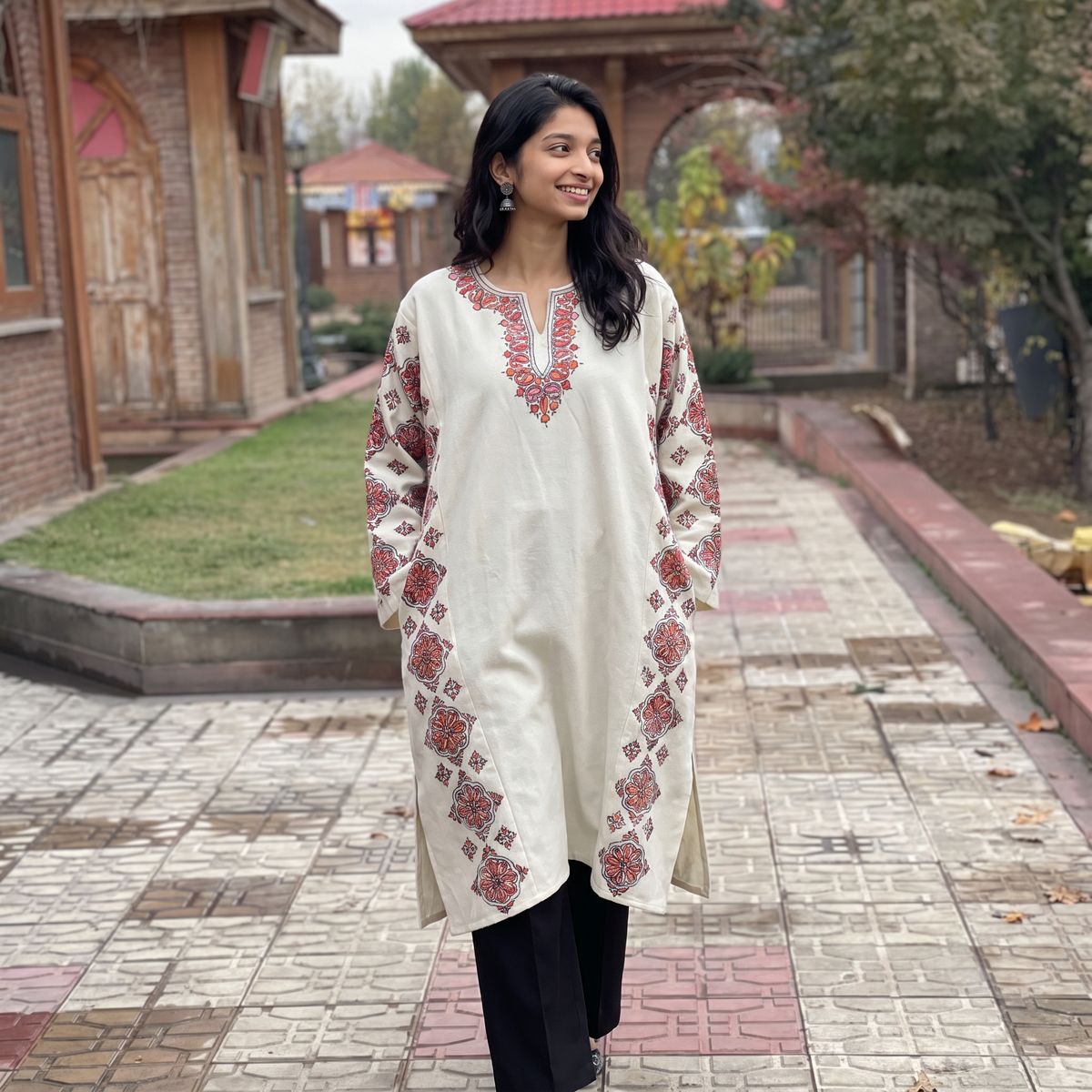 White Kashmiri Heavy Sozni Hand Embroidered Handwoven Merino Wool Pheran, worn by a model, AI visual of the pheran, iTokri