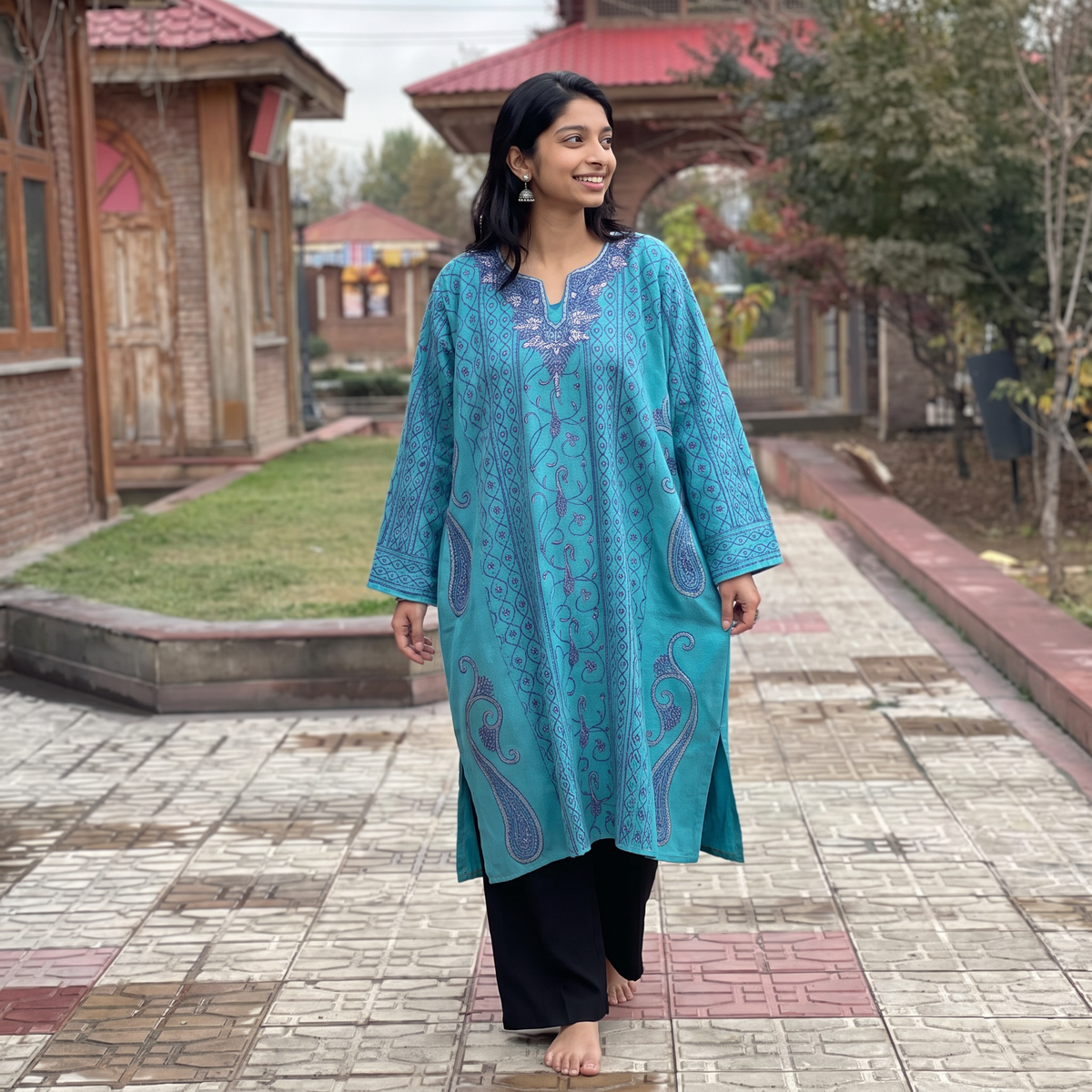 Blue Kashmiri Heavy Sozni Hand Embroidered Handwoven Merino Wool Pheran, worn by a model, AI visual of the pheran, iTokri