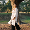 White Kashmiri Heavy Sozni Hand Embroidered Handwoven Merino Wool Pheran, worn by a model, AI visual of the pheran, iTokri