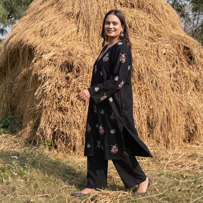 Black Kashmiri Heavy Sozni Hand Embroidered Handwoven Merino Wool Pheran, worn by a model, AI visual of the pheran, iTokri
