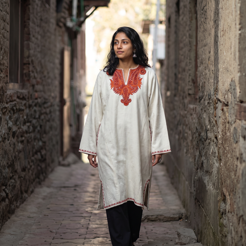 White Kashmiri Sozni Hand Embroidered Handwoven Merino Wool Pheran, worn by a model, AI visual of the pheran, iTokri