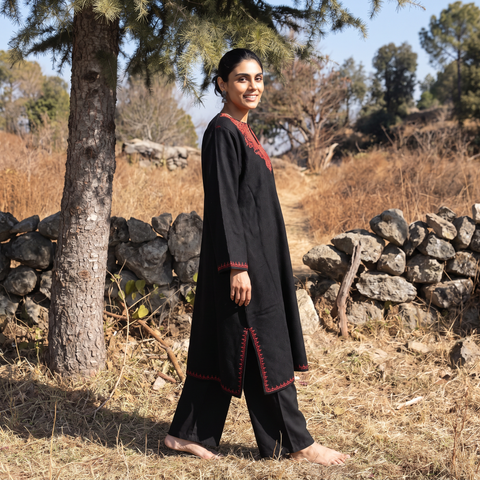 Black Kashmiri Sozni Hand Embroidered Handwoven Merino Wool Pheran, worn by a model, AI visual of the pheran, iTokri