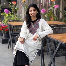 White Kashmiri Sozni Hand Embroidered Handwoven Merino Wool Pheran, worn by a model, AI visual of the pheran, iTokri