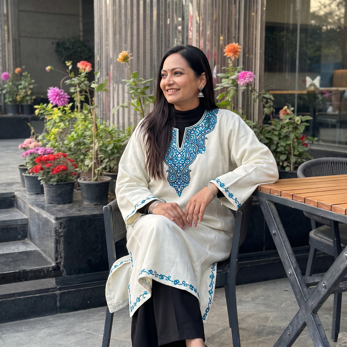 White Kashmiri Sozni Hand Embroidered Handwoven Merino Wool Pheran, worn by a model, AI visual of the pheran, iTokri