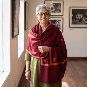 Maroon Kashmiri Sozni Hand Embroidered Pure Handwoven Merino Wool Shawl, worn by a model, AI visual of the shawl, iTokri