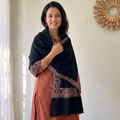 Black Kashmiri Sozni Heavy Hand Embroidered Pure Handwoven Merino Wool Shawl, worn by a model, AI visual of the shawl, iTokri