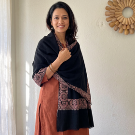 Black Kashmiri Sozni Heavy Hand Embroidered Pure Handwoven Merino Wool Shawl, worn by a model, AI visual of the shawl, iTokri