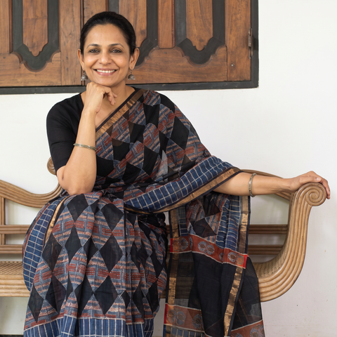 Black Kota Doria Cotton Block Print Bagru Saree, draped and worn by a woman, AI visual of the saree, iTokri