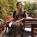Black Kota Doria Cotton Block Print Bagru Saree, draped and worn by a woman, AI visual of the saree, iTokri