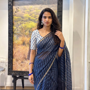 Navy Nazaakat Kota Doria Cotton Plain Saree with Blouse Piece & Earrings, draped and worn by a woman, AI visual of the saree, iTokri