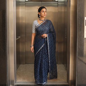 Navy Nazaakat Kota Doria Cotton Plain Saree with Blouse Piece & Earrings, draped and worn by a woman, AI visual of the saree, iTokri