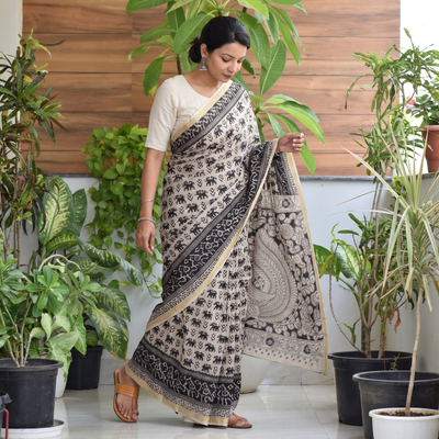 Black Kota Doria Cotton Printed Kalamkari Saree, draped and worn by a woman, AI visual of the saree, iTokri
