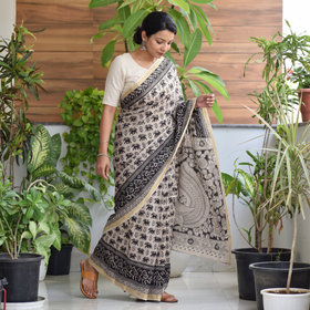 Black Kota Doria Cotton Printed Kalamkari Saree, draped and worn by a woman, AI visual of the saree, iTokri