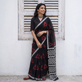 Black Sanganeri hand block print Kota Doria cotton saree with bold geometric motifs, draped and worn by a woman, AI visual of the saree, iTokri