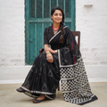 Black Sanganeri hand block print Kota Doria cotton saree with bold geometric motifs, draped and worn by a woman, AI visual of the saree, iTokri