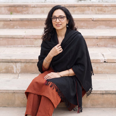 Black Kumaun Handwoven Pure Merino Wool Shawl, worn by a model, AI visual of the shawl, iTokri