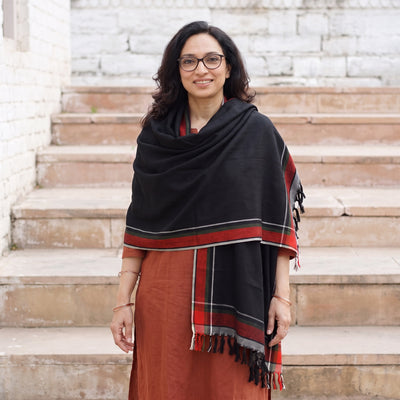 Black Kumaun Handwoven Pure Merino Wool Shawl, worn by a model, AI visual of the shawl, iTokri
