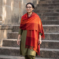 Orange Kumaun Handwoven Pure Merino Wool Shawl, worn by a model, AI visual of the shawl, iTokri