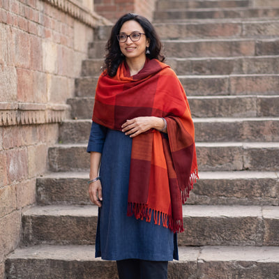 Orange Kumaun Handwoven Pure Merino Wool Shawl, worn by a model, AI visual of the shawl, iTokri