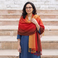Red Kumaun Handwoven Pure Merino Wool Shawl, worn by a model, AI visual of the shawl, iTokri