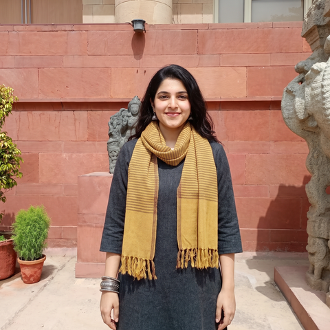 Yellow Kumaun Handwoven Pure Merino Wool Stole, worn by a woman, AI visual of the stole, iTokri