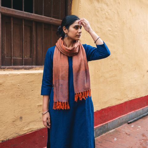Orange Kumaun Handwoven Pure Merino Wool Stole, worn by a woman, AI visual of the stole, iTokri