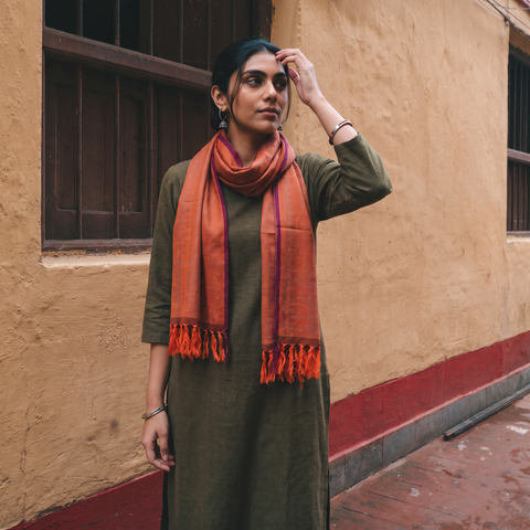 Orange Kumaun Handwoven Pure Merino Wool Stole, worn by a woman, AI visual of the stole, iTokri