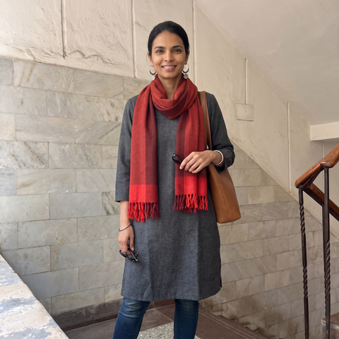 Red Kumaun Handwoven Pure Merino Wool Stole, worn by a woman, AI visual of the stole, iTokri