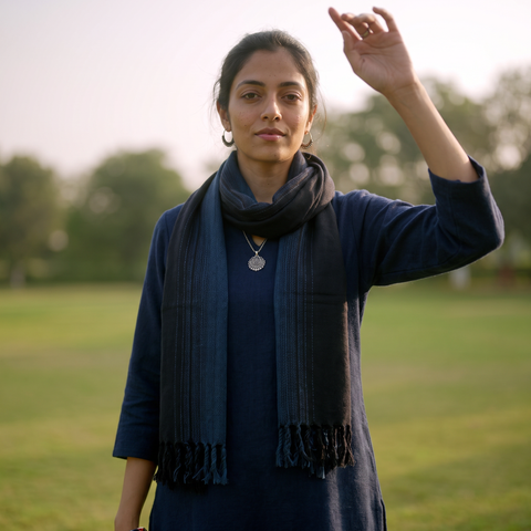 Black Kumaun Handwoven Pure Merino Wool Stole, worn by a woman, AI visual of the stole, iTokri