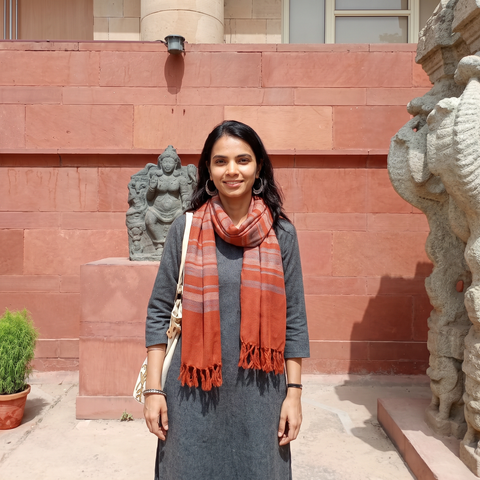 Orange Kumaun Handwoven Pure Merino Wool Stole, worn by a woman, AI visual of the stole, iTokri
