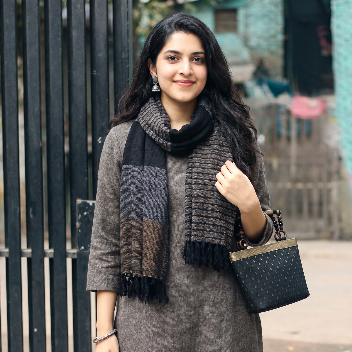 Black Kumaun Handwoven Pure Merino Wool Stole, worn by a woman, AI visual of the stole, iTokri
