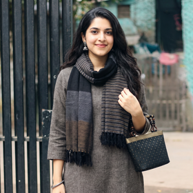 Black Kumaun Handwoven Pure Merino Wool Stole, worn by a woman, AI visual of the stole, iTokri