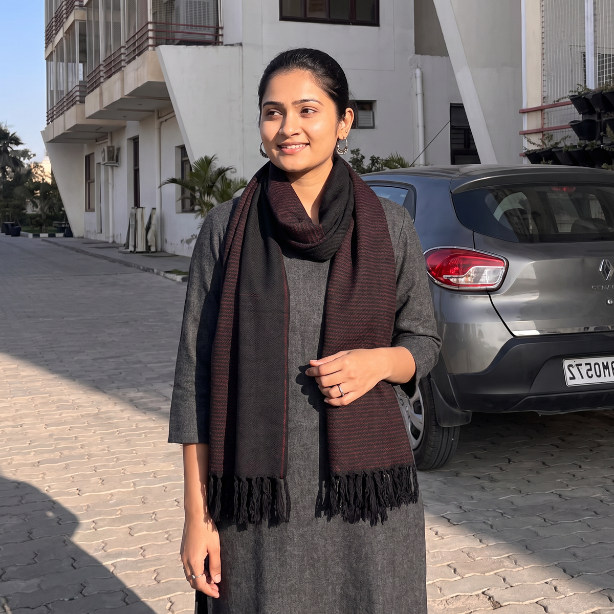 Black Kumaun Handwoven Pure Merino Wool Stole, worn by a woman, AI visual of the stole, iTokri