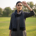 Black Kumaun Handwoven Pure Merino Wool Stole, worn by a woman, AI visual of the stole, iTokri