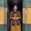 Brown Kumaun Handwoven Pure Merino Wool Stole, worn by a woman, AI visual of the stole, iTokri