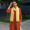 Yellow Kumaun Handwoven Pure Merino Wool Stole, worn by a woman, AI visual of the stole, iTokri