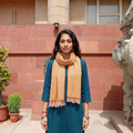 Yellow Kumaun Handwoven Pure Merino Wool Stole, worn by a woman, AI visual of the stole, iTokri