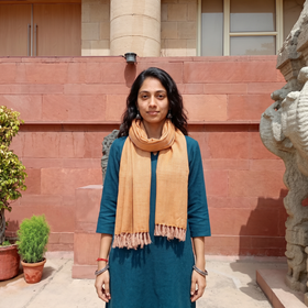 Yellow Kumaun Handwoven Pure Merino Wool Stole, worn by a woman, AI visual of the stole, iTokri