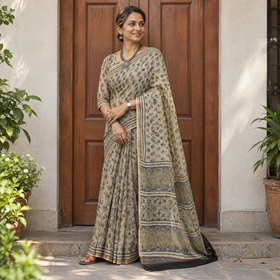 Beige Kutch Ajrakh hand block print natural dyed Kota Doria cotton saree, draped and worn by a woman, AI visual of the saree, iTokri