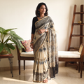 Beige and black Kutch Ajrakh hand block print natural dyed Kota Doria cotton saree, draped and worn by a woman, AI visual of the saree, iTokri