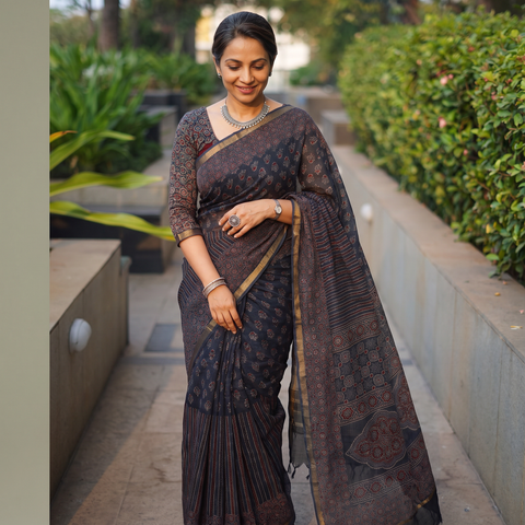 Black Kutch Ajrakh hand block print natural dyed Kota Doria cotton saree, draped and worn by a woman, AI visual of the saree, iTokri