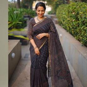 Black Kutch Ajrakh hand block print natural dyed Kota Doria cotton saree, draped and worn by a woman, AI visual of the saree, iTokri