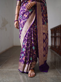 Purple Kutch Bandhani Fine Georgette Banarasi Neem Zari Jaal Saree, draped and worn by a woman, AI visual of the saree, iTokri