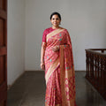 Peach Kutch Bandhani Fine Georgette Banarasi Neem Zari Jaal Saree, draped and worn by a woman, AI visual of the saree, iTokri