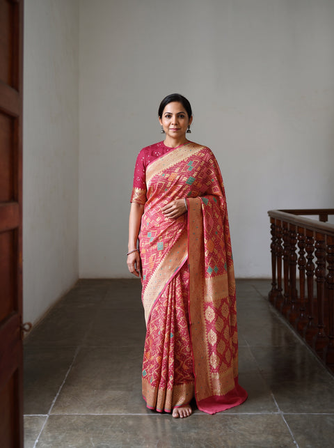 Peach Kutch Bandhani Fine Georgette Banarasi Neem Zari Jaal Saree, draped and worn by a woman, AI visual of the saree, iTokri