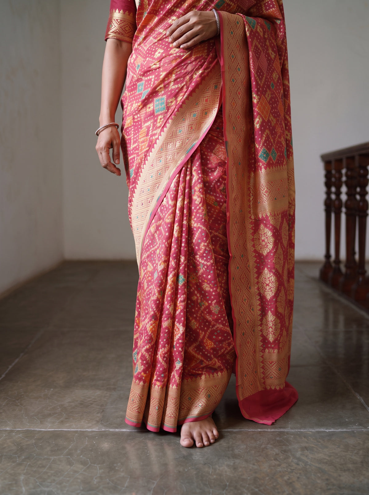 Peach Kutch Bandhani Fine Georgette Banarasi Neem Zari Jaal Saree, draped and worn by a woman, AI visual of the saree, iTokri