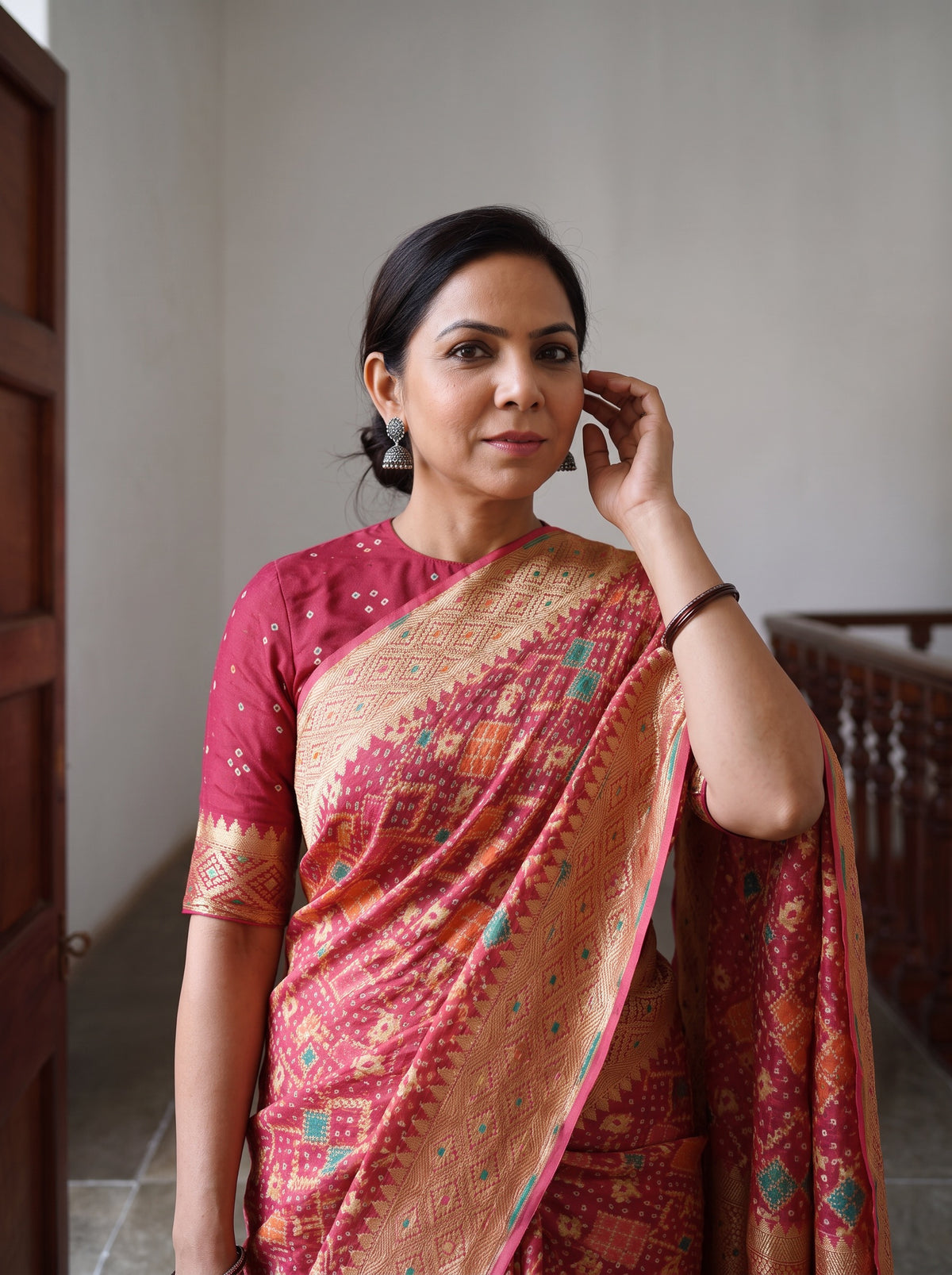 Peach Kutch Bandhani Fine Georgette Banarasi Neem Zari Jaal Saree, draped and worn by a woman, AI visual of the saree, iTokri