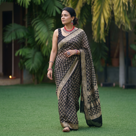 Black Kutch Bandhani Fine Georgette Banarasi Neem Zari Jaal Saree, draped and worn by a woman, AI visual of the saree, iTokri
