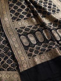 Black Kutch Bandhani Fine Georgette Banarasi Neem Zari Jaal Saree, draped and worn by a woman, AI visual of the saree, iTokri