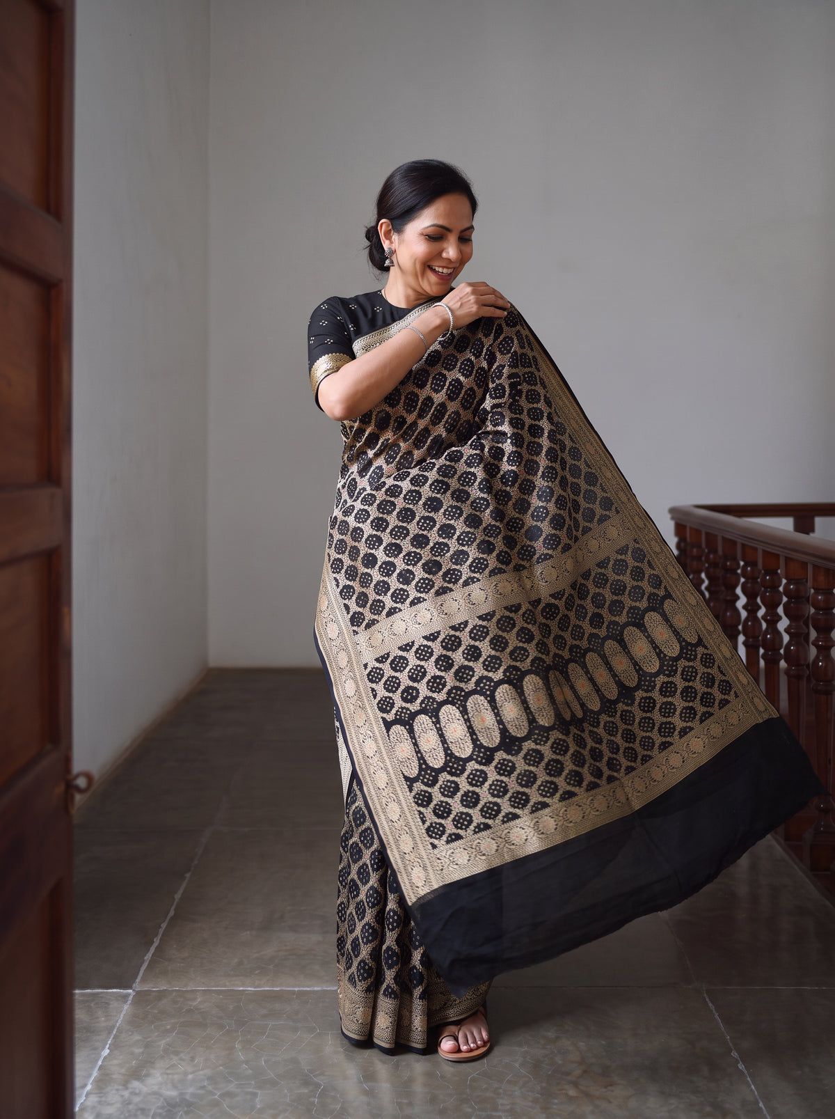 Black Kutch Bandhani Fine Georgette Banarasi Neem Zari Jaal Saree, draped and worn by a woman, AI visual of the saree, iTokri